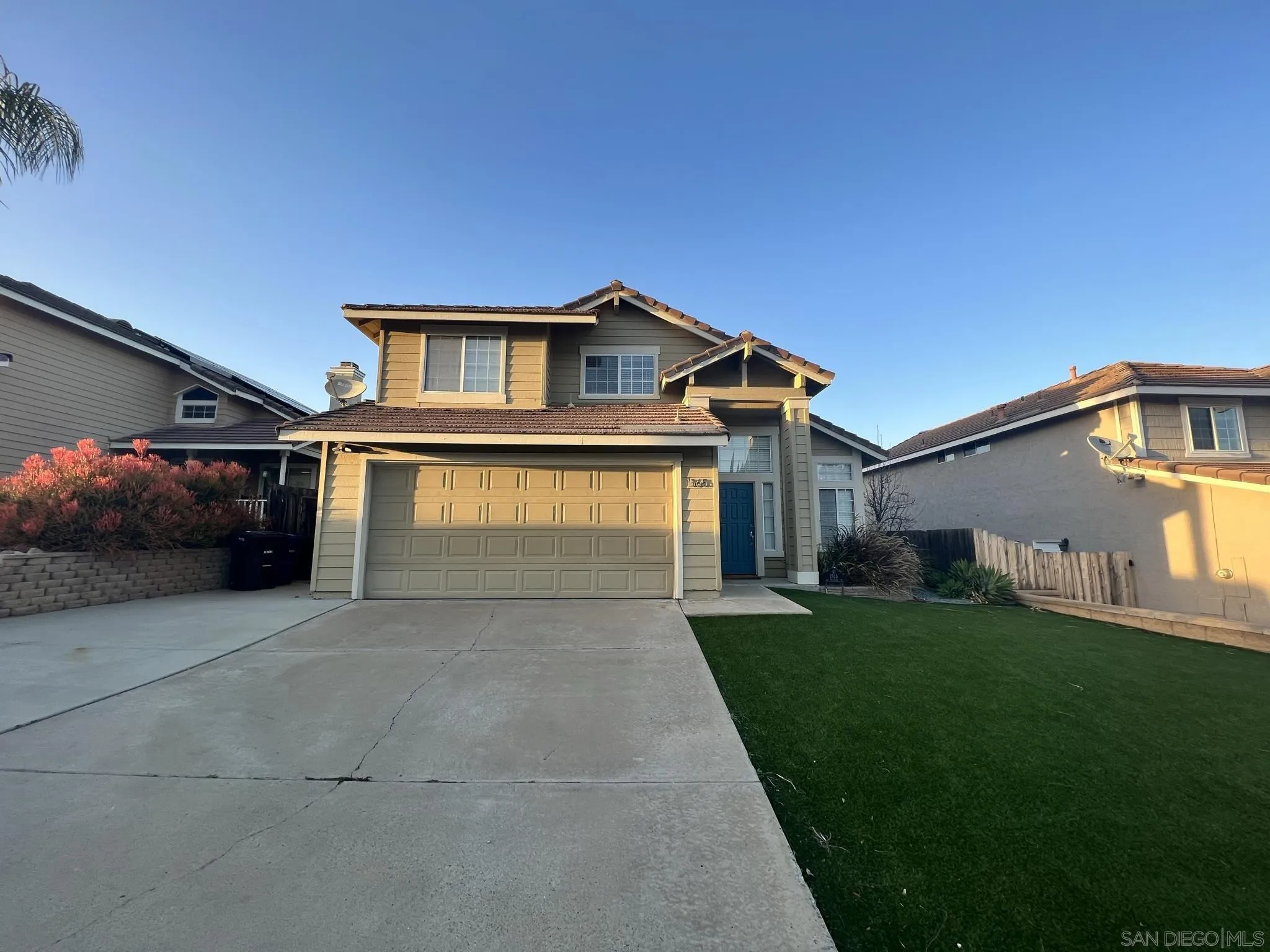 1565 Bay Meadows Drive Alpine, CA 91901 - Photo 2 of 23 a front view of a house with a yard and garage