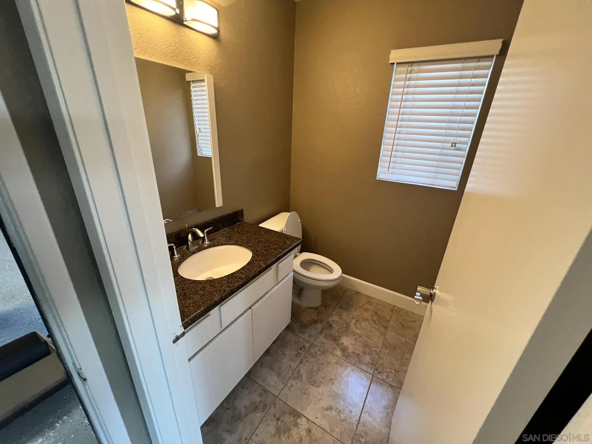1565 Bay Meadows Drive Alpine, CA 91901 - Photo 23 of 23 a bathroom with a sink and a mirror
