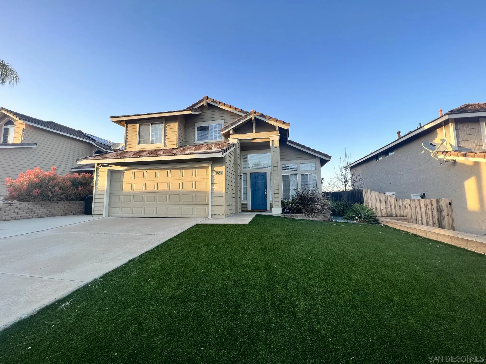1565 Bay Meadows Drive Alpine, CA 91901 - Photo 3 of 23 a front view of a house with a yard and garage