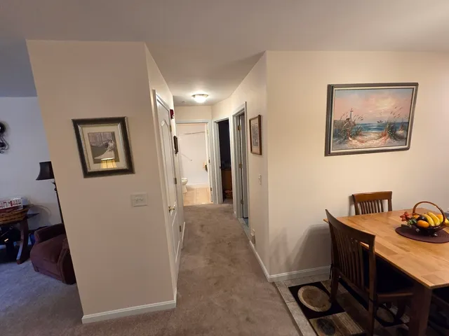 a view of a workspace with furniture and a workspace