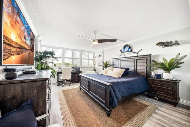 a bed room with a bed and a television