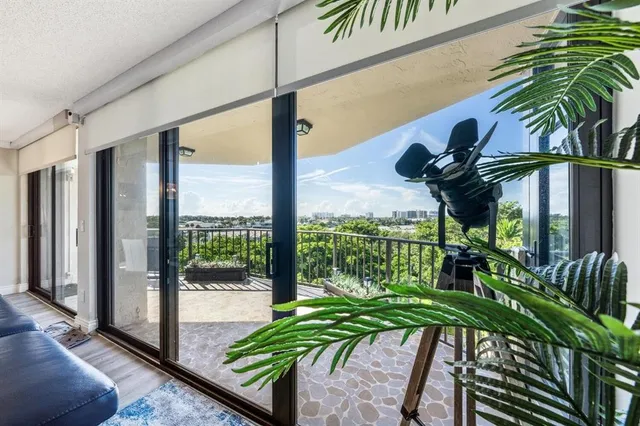 a view of a balcony with potted plants