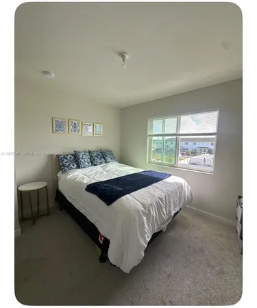 a bedroom with a bed and furniture