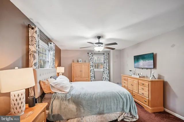 a bed room with a bed and a window