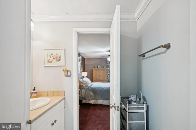 a en suite bathroom with a sink and a bath tub