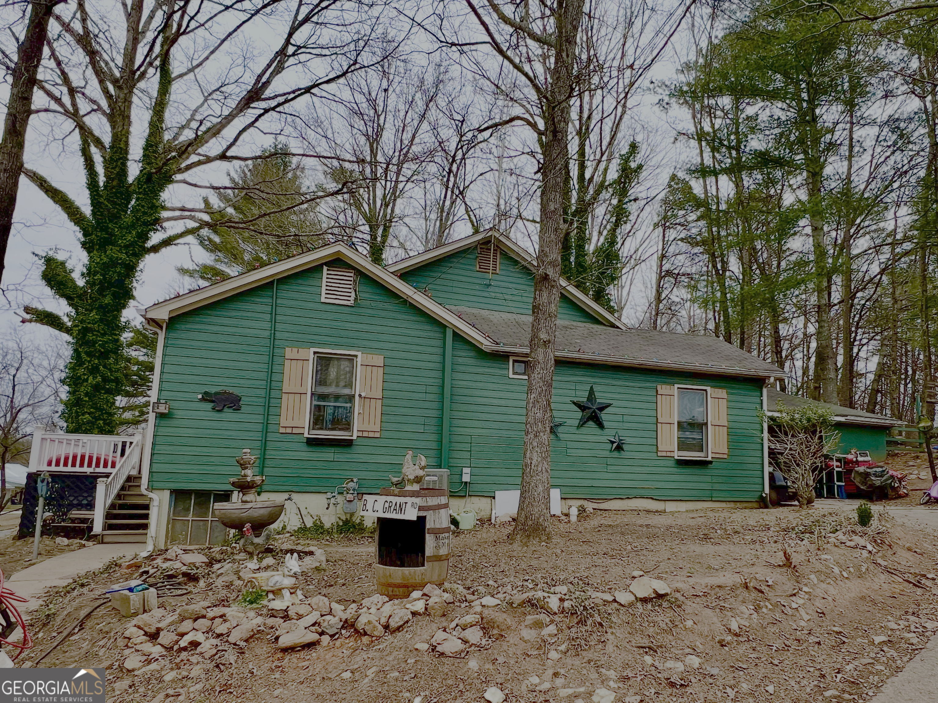 3402 B C Grant Road Cornelia, GA 30531 - Photo 5 of 12 a view of a house with a patio and a fire pit