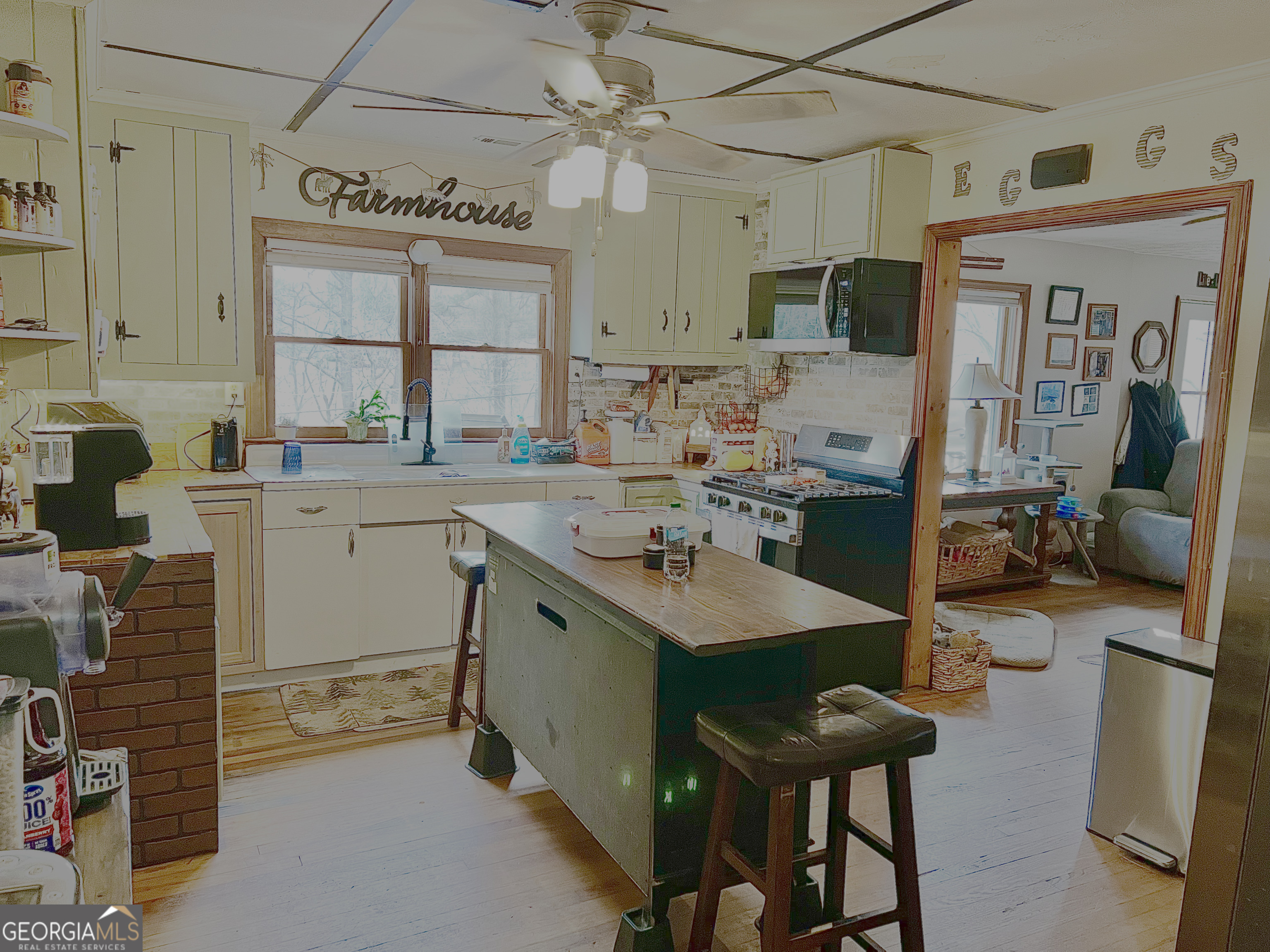 3402 B C Grant Road Cornelia, GA 30531 - Photo 7 of 12 a view of a kitchen with kitchen island granite countertop a sink and appliances