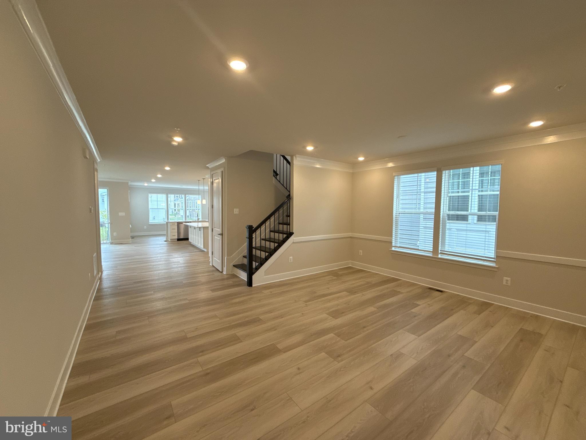 116 Stilly Way Annapolis, MD 21403 - Photo 2 of 21 a view of an empty room with wooden floor and a window