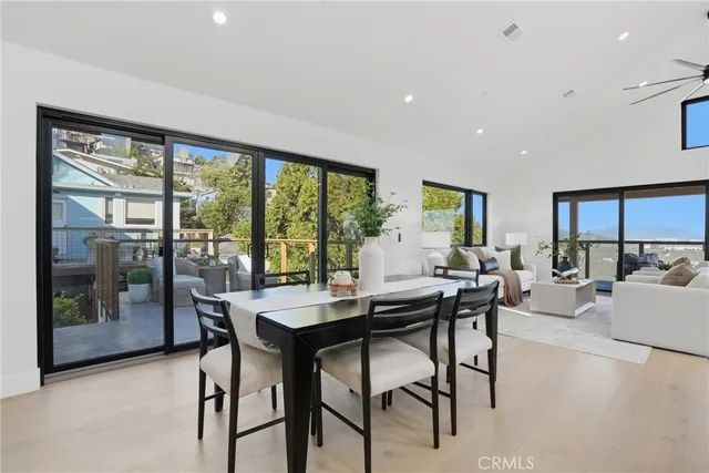 a kitchen with a stove a table and chairs