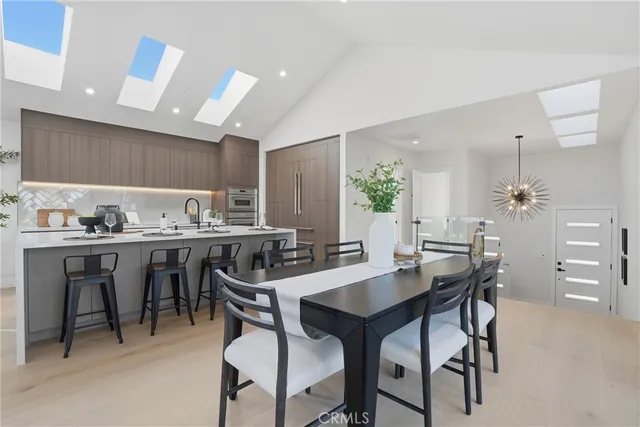a kitchen with counter top space a sink and a large window