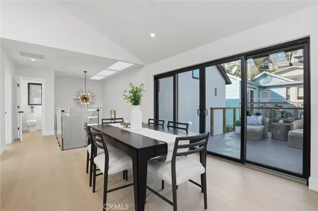 a kitchen with a sink a stove and chairs