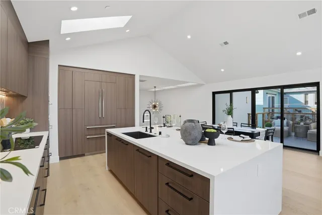 a view of a dining room with furniture and a large window