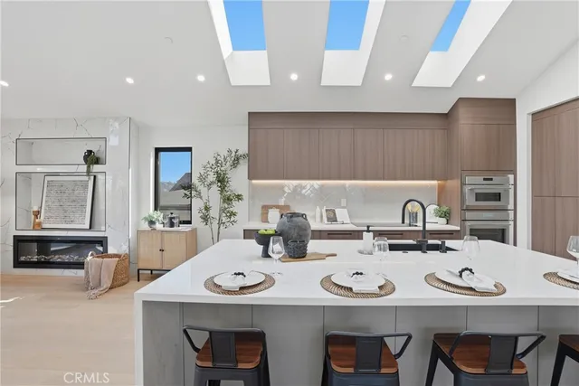 a view of a livingroom with furniture and a floor to ceiling window