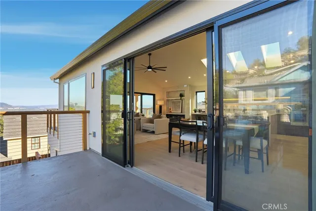 a bedroom with a bed and a ceiling fan