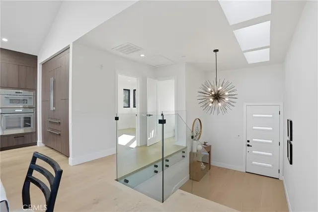 a view of a dining room with furniture and a large window