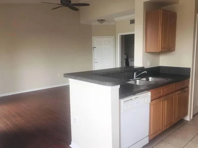 a kitchen with a sink and cabinets