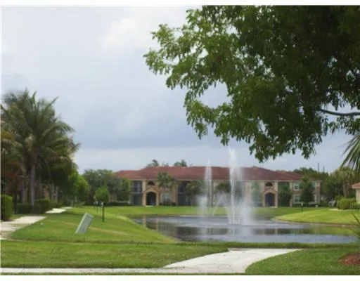 a view of a fountain in front of a house