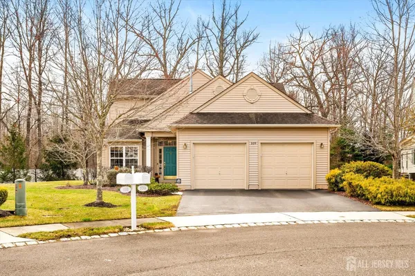 a front view of a house with a outdoor space and garage