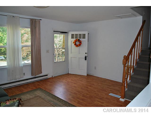 6137 Trotters Ridge Road Charlotte, NC 28227 - Photo 3 of 11 a view of an empty room with window and stairs
