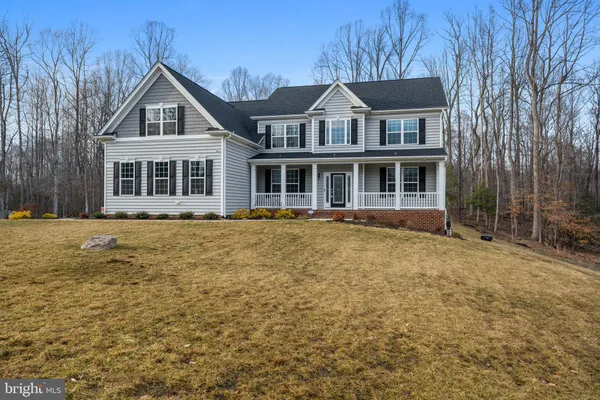a swimming pool with outdoor seating and yard