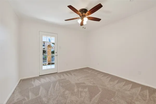 an empty room with fan