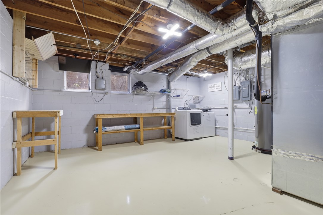 4304 Old Buncombe Road Greenville, SC 29617 - Photo 36 of 49 This spacious basement offers ample room for storage and includes convenient laundry facilities.
