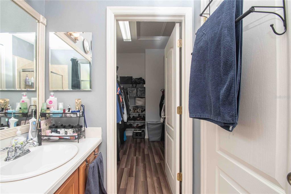 269 Fairmont Drive Spring Hill, FL 34609 - Photo 11 of 32 a kitchen with sink refrigerator and stove
