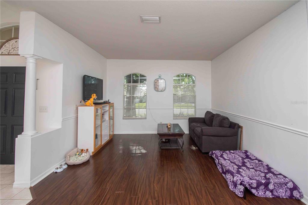 269 Fairmont Drive Spring Hill, FL 34609 - Photo 19 of 32 a living room with furniture and a wooden floor