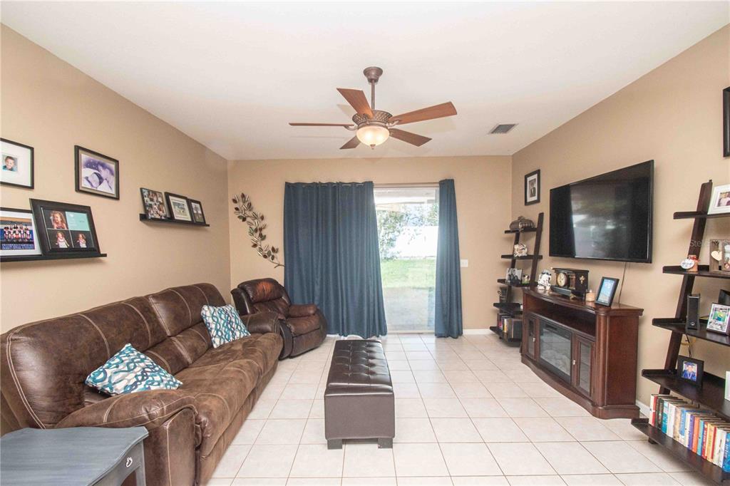 269 Fairmont Drive Spring Hill, FL 34609 - Photo 21 of 32 a living room with furniture and a flat screen tv