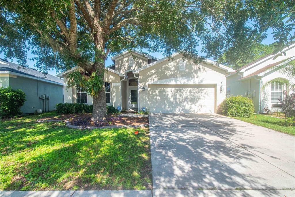 269 Fairmont Drive Spring Hill, FL 34609 - Photo 25 of 32 a view of a chair and table in backyard of house