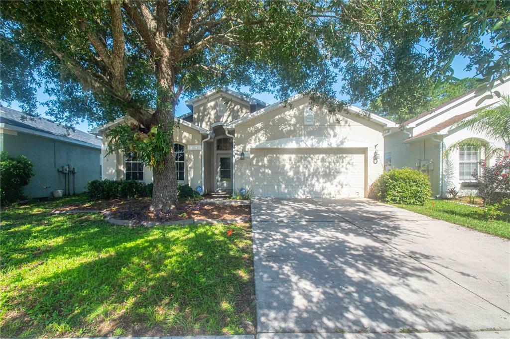 269 Fairmont Drive Spring Hill, FL 34609 - Photo 26 of 32 a view of a house with a yard