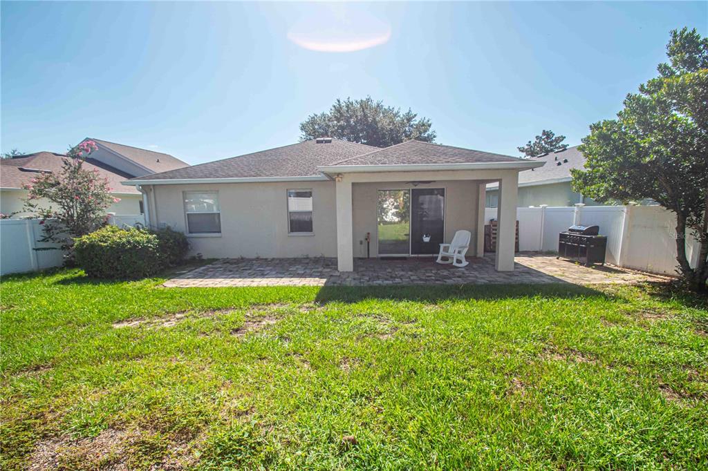 269 Fairmont Drive Spring Hill, FL 34609 - Photo 28 of 32 a front view of a house with garden