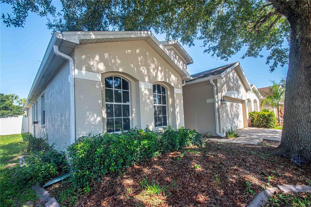 269 Fairmont Drive Spring Hill, FL 34609 - Photo 31 of 32 a view of a house with a yard