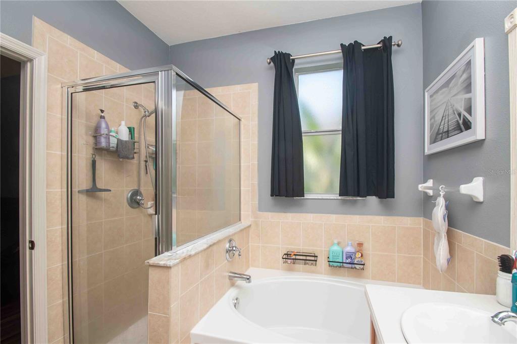 269 Fairmont Drive Spring Hill, FL 34609 - Photo 10 of 32 a bathroom with a bathtub and a sink