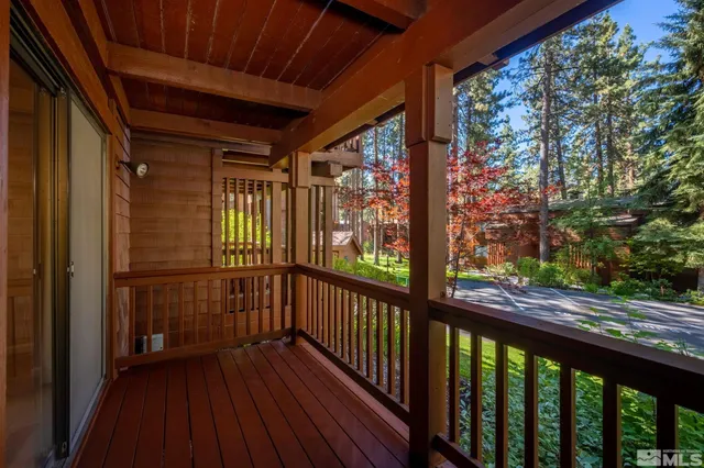 a view of a porch with wooden floor