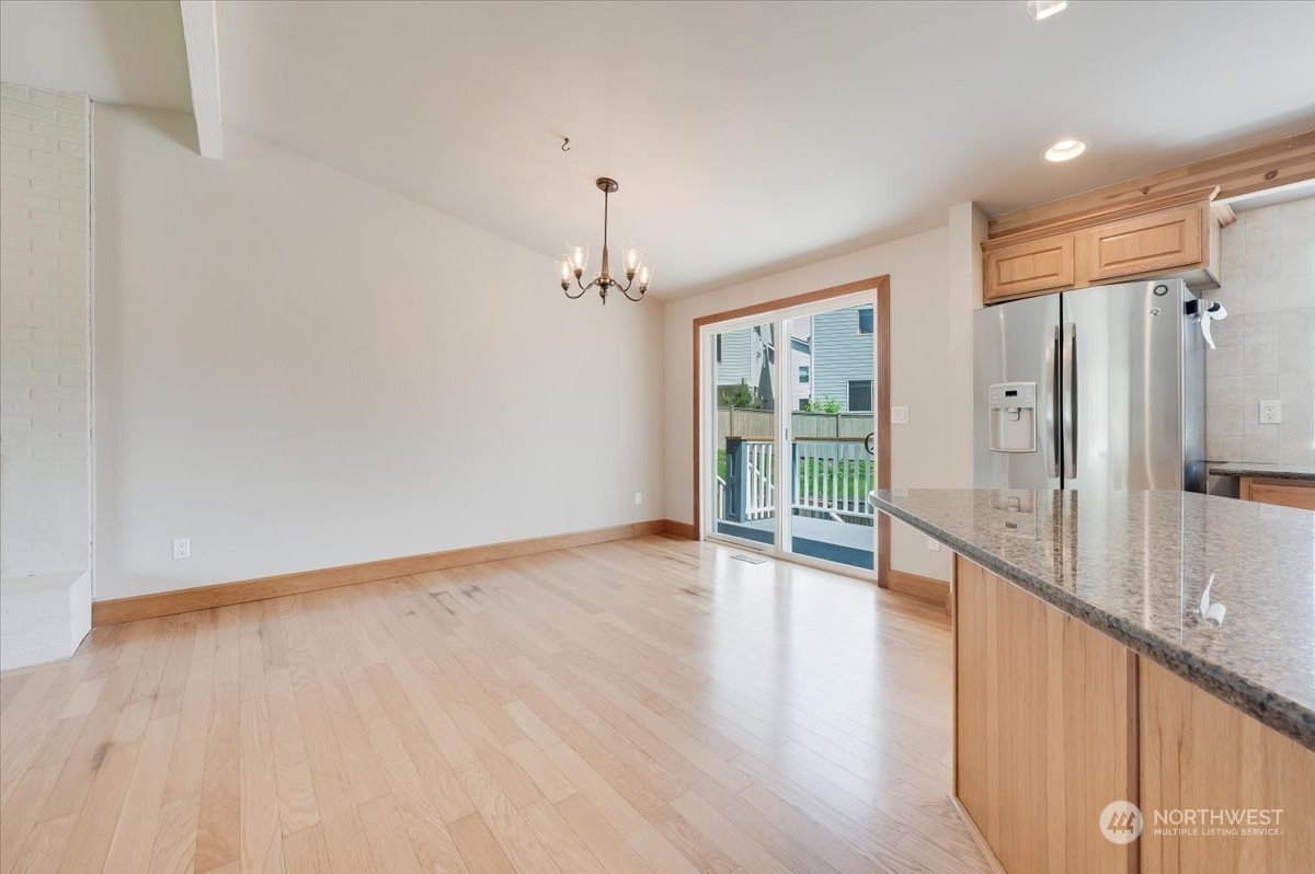 17917 30th Drive Southeast Bothell, WA 98012 - Photo 11 of 30 wooden floor in an empty room with a window