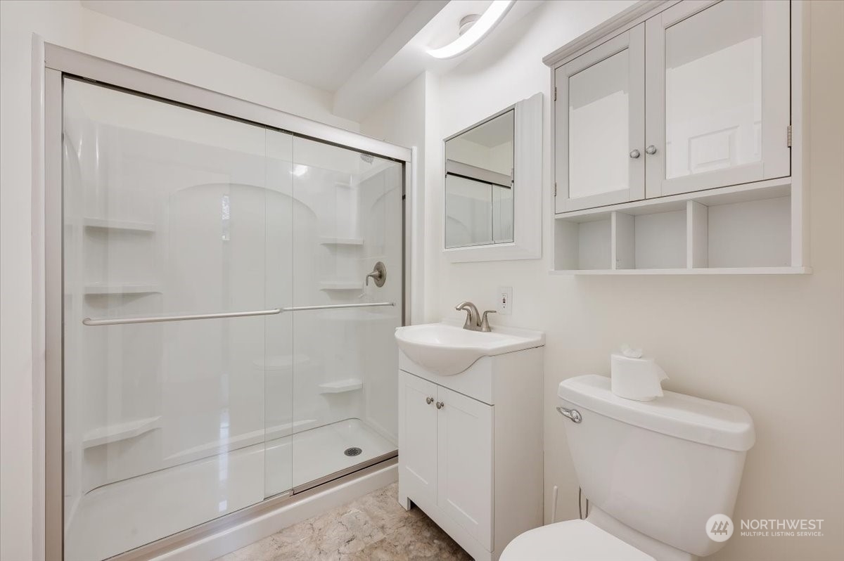 17917 30th Drive Southeast Bothell, WA 98012 - Photo 22 of 30 a bathroom with a shower a toilet and sink