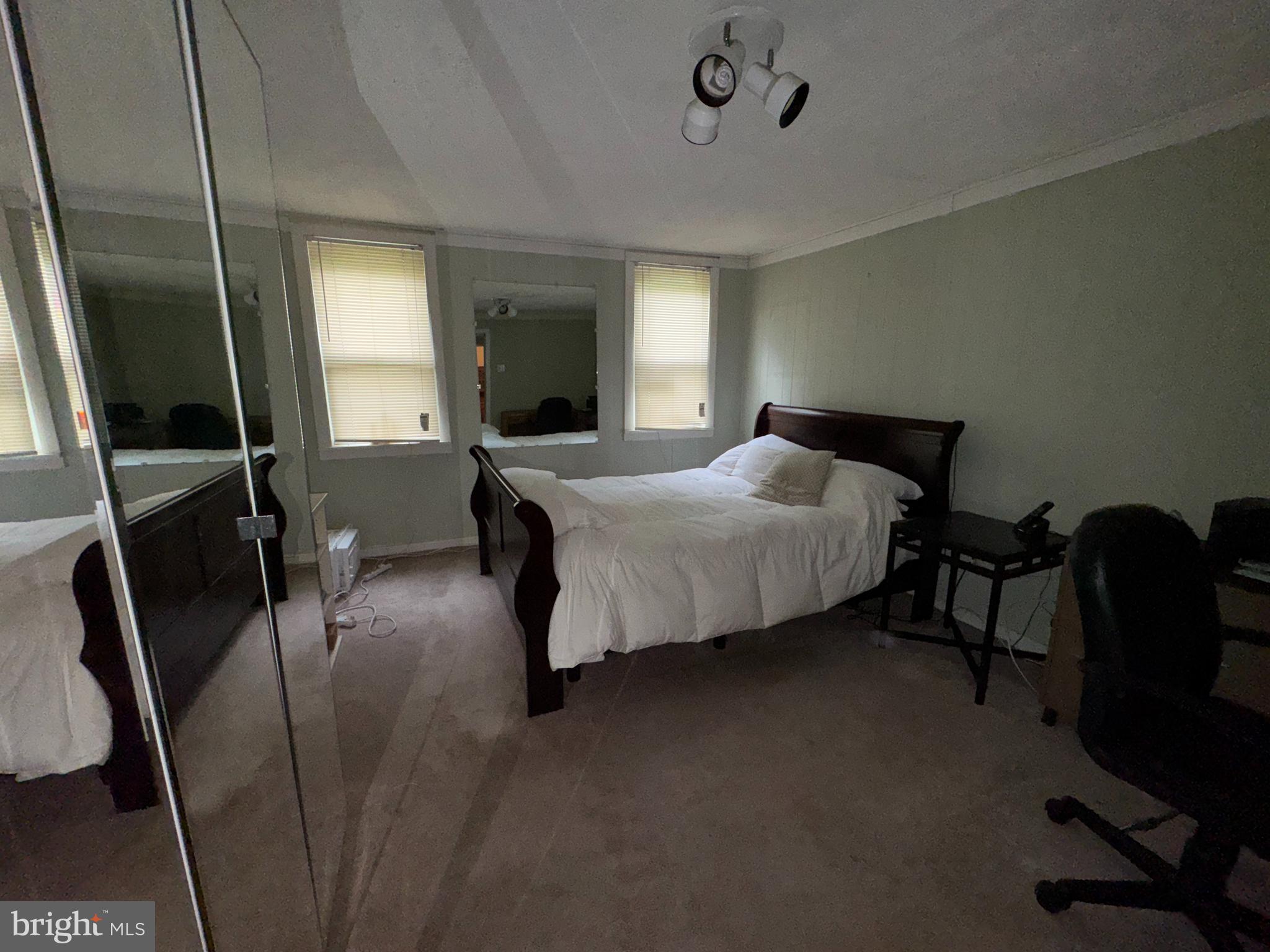 13 Cramer Road Tabernacle, NJ 08088 - Photo 40 of 48 a bedroom with a bed tv and a chair