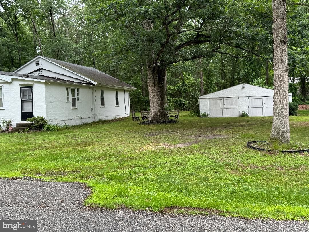 13 Cramer Road Tabernacle, NJ 08088 - Photo 8 of 48 a front view of a house with a garden and yard