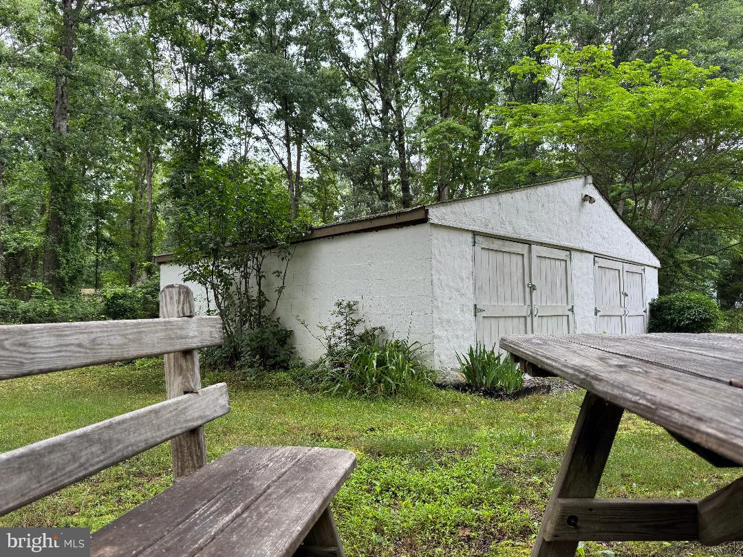 13 Cramer Road Tabernacle, NJ 08088 - Photo 9 of 48 a view of a backyard with wooden fence