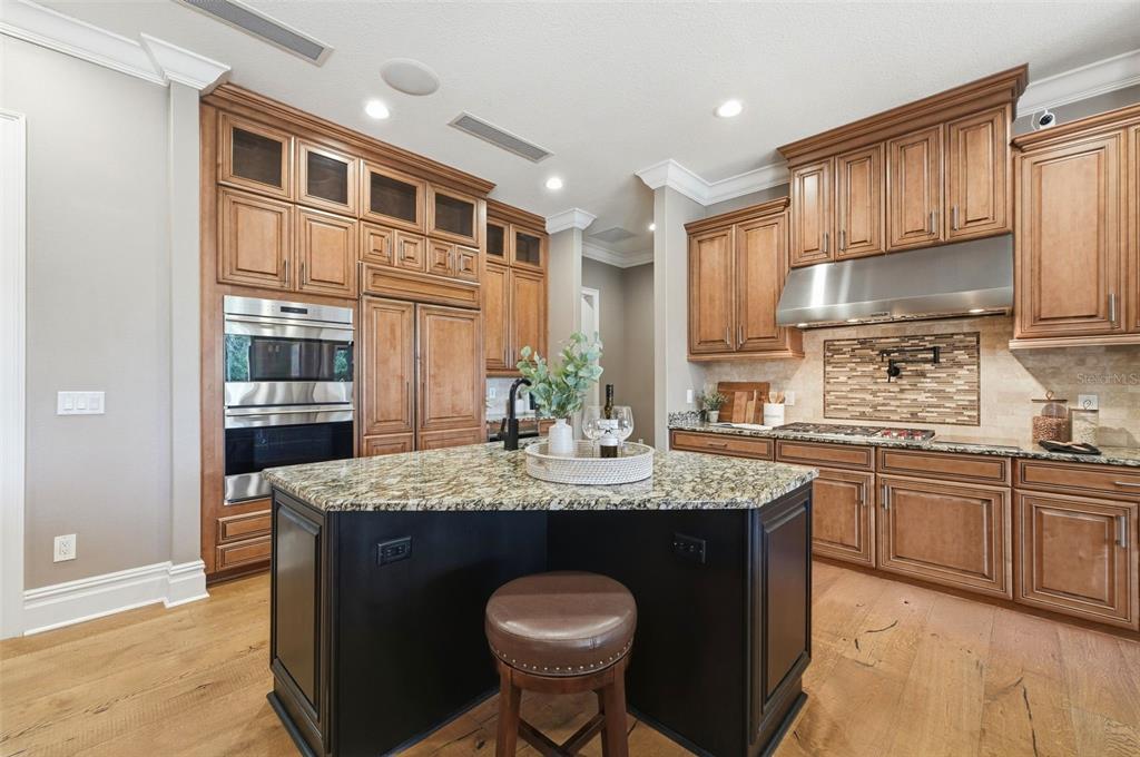 855 Southeast 87th Street Ocala, FL 34480 - Photo 24 of 79 a kitchen with stainless steel appliances granite countertop a sink a stove and cabinets