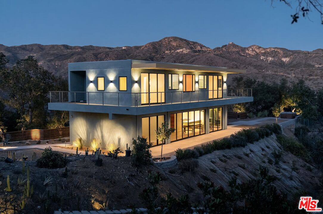 27349 Old Chimney Road Malibu, CA 90265 - Photo 7 of 9 a view of a house with a yard
