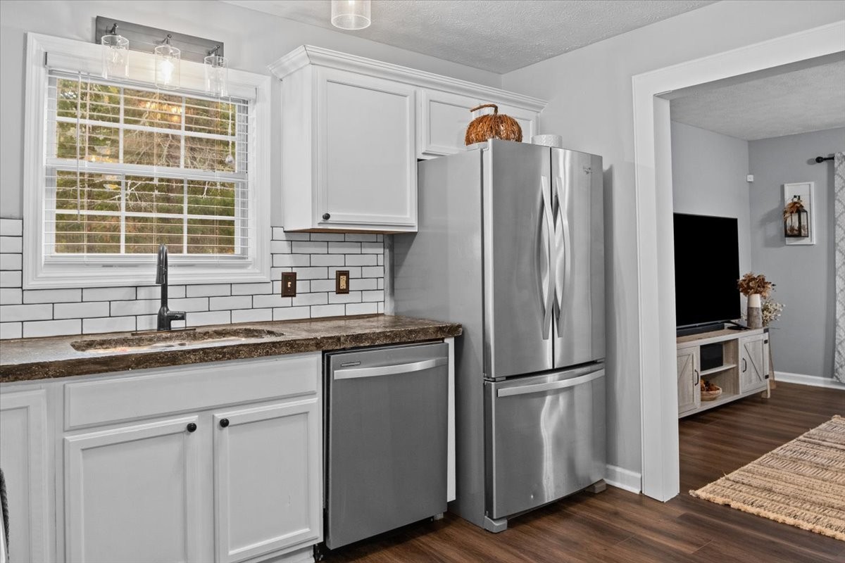 5790 Washer Road Lyles, TN 37098 - Photo 21 of 31 a kitchen with appliances a sink and a window
