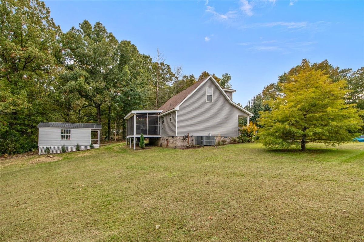 5790 Washer Road Lyles, TN 37098 - Photo 6 of 31 a view of a house with a backyard