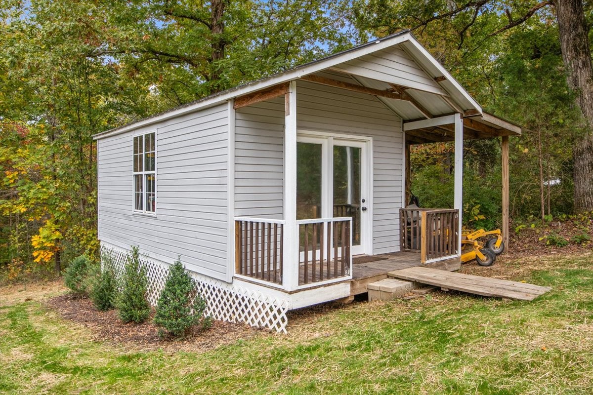 5790 Washer Road Lyles, TN 37098 - Photo 8 of 31 a view of a house with backyard and porch