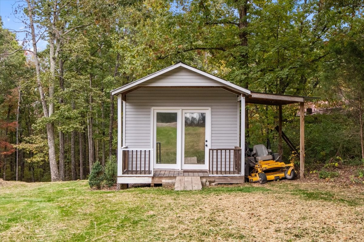 5790 Washer Road Lyles, TN 37098 - Photo 9 of 31 a view of a house with backyard porch and sitting area
