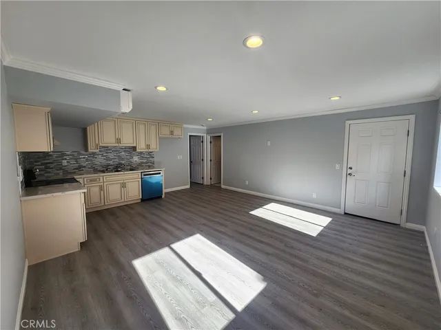 a kitchen with stainless steel appliances granite countertop a stove and a refrigerator