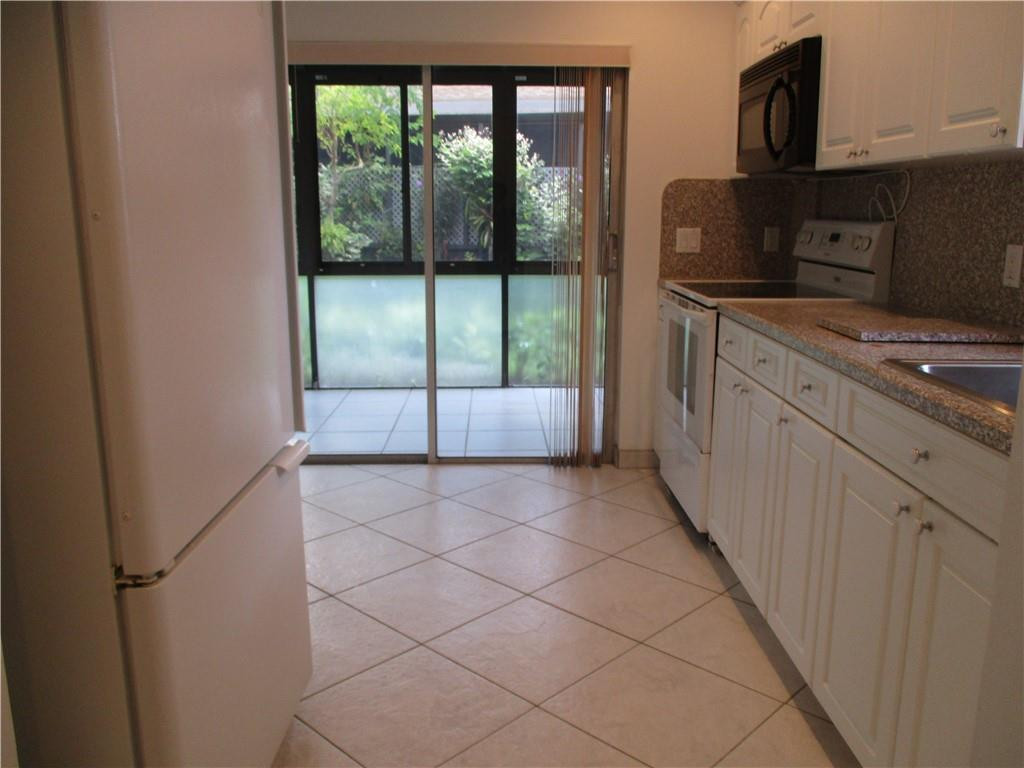 8897 Echo Lane, Unit D Boca Raton, FL 33496 - Photo 3 of 32 Renovated kitchen