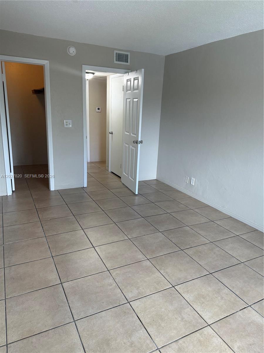 6841 Pembroke Road, Unit 15 Pembroke Pines, FL 33023 - Photo 8 of 16 a view of a livingroom with an empty space and a sink