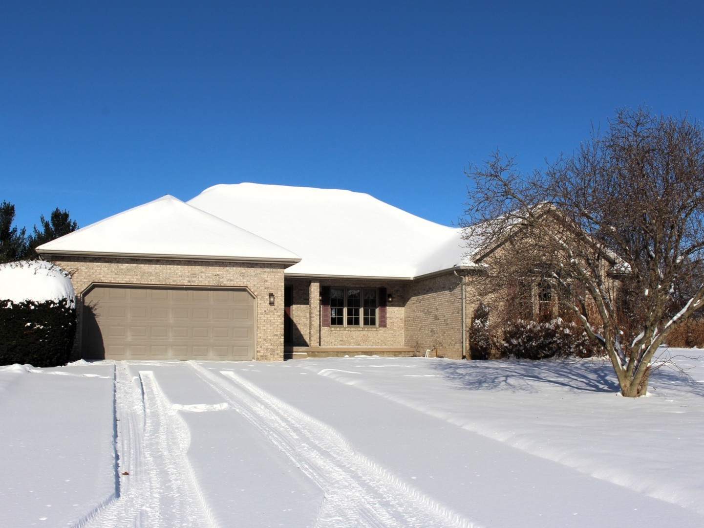 a view of a white house with a yard